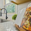 White granite worktop with a cookbook and stand